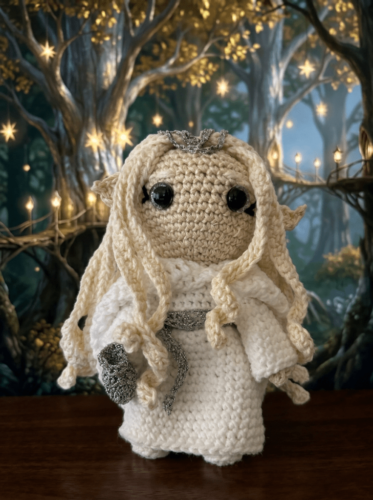 Crocheted Galadriel standing in Lorien